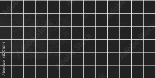 Black square ceramic tile wall background with white grout lines, modern dark bathroom or kitchen interior stone texture pattern, minimalist architecture backdrop for design and copy space.