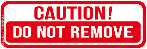 sign in red color that says : caution , do not remove