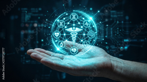 Human hand holding glowing blue medical holographic interface with diverse healthcare icons representing modern digital innovation and future medicine technology concepts