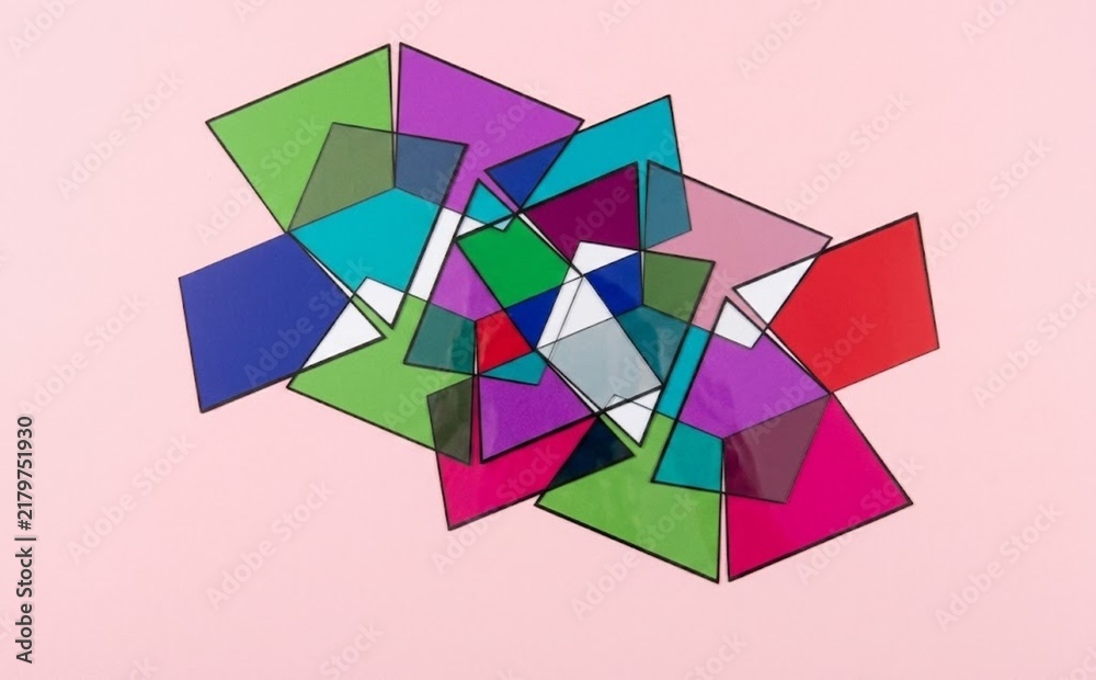 Obraz premium Overlapping Translucent Colorful Geometric Shapes on Light Pink Background, Studio Still Life Shot