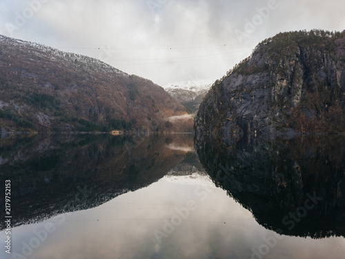 Scenic view of Norwegian fjord with mountain reflection in calm water