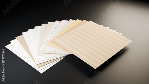 Fotografie Craft and speciality paper sheets fanned out on a dark background