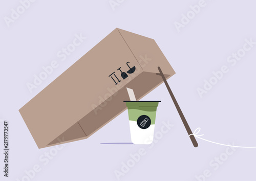 Foto An ironical setup features a cardboard and stick trap holding a delicious cup of matcha latte, inviting the observer to laugh at the trendy drink craze, The setting is playful and creative