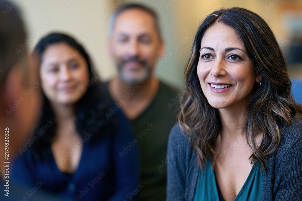 Fototapeta premium Counselor engaging with two adult clients during professional meeting