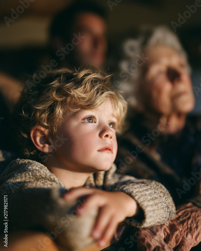 Child And Elderly Grandmother Sharing An Affectionate Intergenerational Family Moment