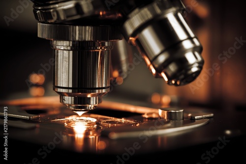 A detailed view of a laboratory microscope poised for scientific research and precise analysis, highlighting the importance of tools in medical investigations