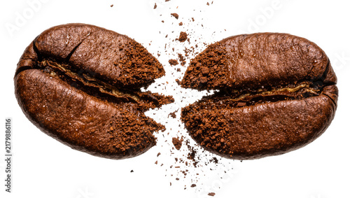 Canvastavla Two halves of a dark roasted coffee bean breaking apart with fine powder, isolat