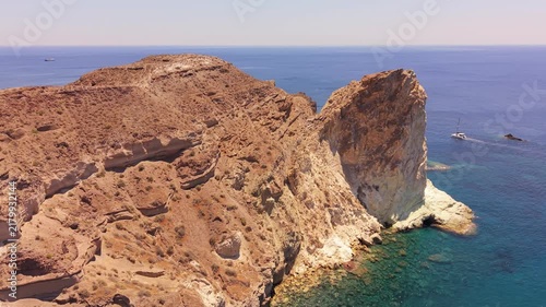 Drone footage of turtle rock formation and volcanic coast at White Beach Akrotiri Santorini Greece