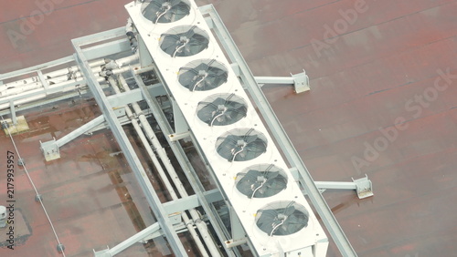 Industrial row of AC units on metal rooftop frame. Top view, technology. high quality 4k video.