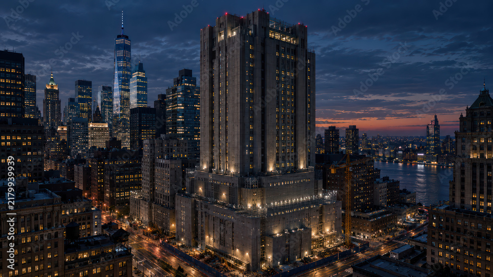 Fototapeta premium High Security Institutional Tower Illuminated in Downtown Skyline at Night