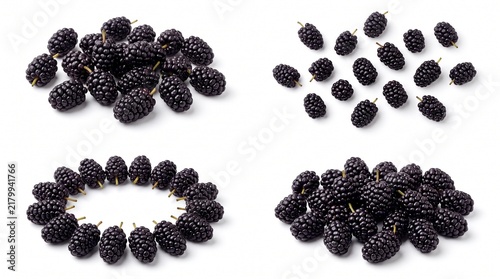 Fresh ripe black mulberries organized in piles and circles