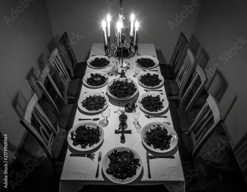 Long table set for formal dinner.