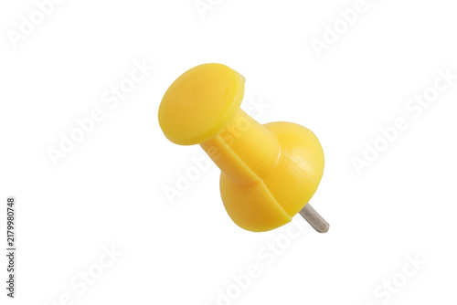 Foto Studio macro shot of single yellow plastic push pin with metallic needle lying flat