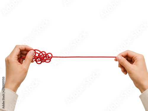 Hands Untangling Red Rope Knot | Problem Solving & Finding Solutions Concept