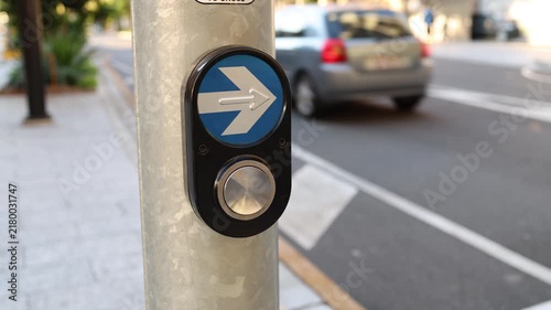 close-up of a pedestrian crossing button in a city