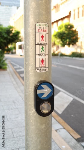 close-up of a pedestrian crossing button in a city
