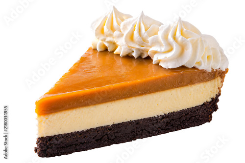 Creamy pumpkin cheesecake slice with whipped cream, isolated on a transparent background