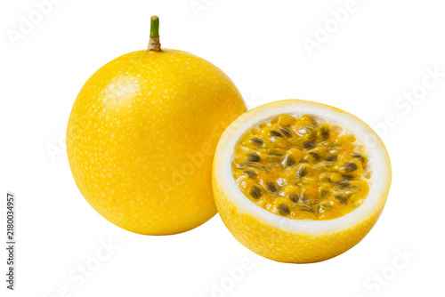 Fresh yellow passion fruits, whole and sliced, isolated on a transparent background