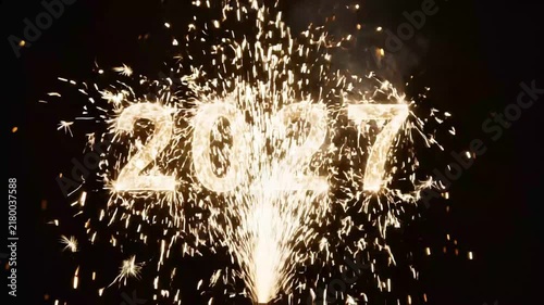 Golden sparklers forming the year 2027 with bright fireworks on transparent background