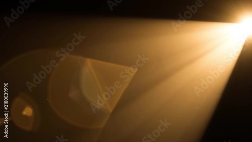 Bright golden light beam shining diagonally against a dark background on transparent background
