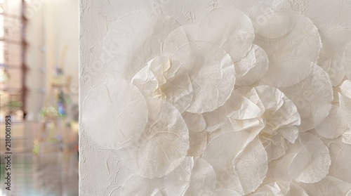 Elegant white textured studio surface featuring organic circular patterns for creative backgrounds and artistic projects