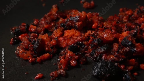 Close-up of seared, crumbly chorizo with glossy red-brown crust