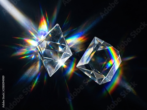 Glass prisms refracting light into colorful spectrums suitable for science and optics media symbolizing clarity vision and creative focus