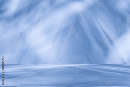 Wall interior background, studio and backdrops show products.with shadow from window color white and blue background for text insertion and presentation product	
