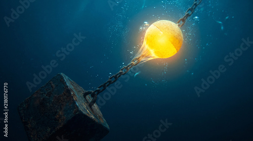 Rising Above Stress Optimism Concept Glowing Yellow Cork Pulling Heavy Iron Weight Underwater