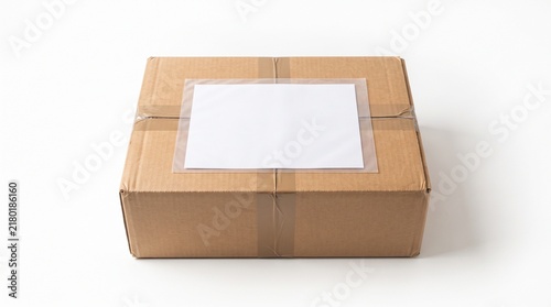 Top View of Sealed Cardboard Box with Blank White Shipping Label