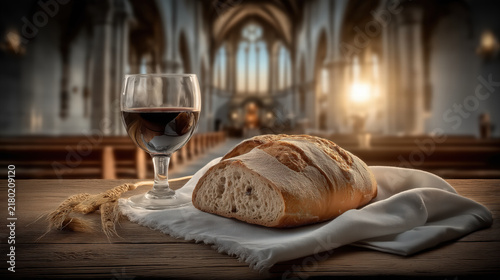 Communion elements of wine cup and bread in a modern church setting during sacred Eucharist ceremony