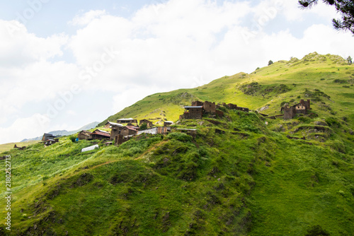 A striking view of the historic village of Chigo, perched dramatically on the steep mountain slopes of Tusheti