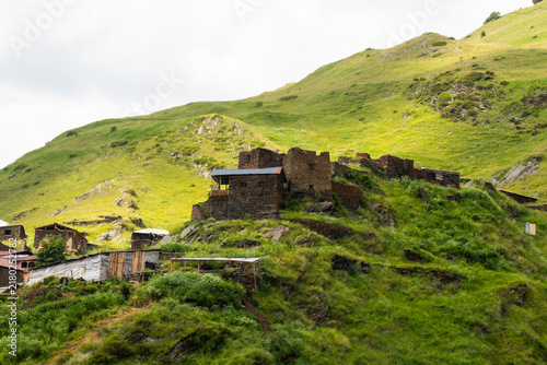 A striking view of the historic village of Chigo, perched dramatically on the steep mountain slopes of Tusheti