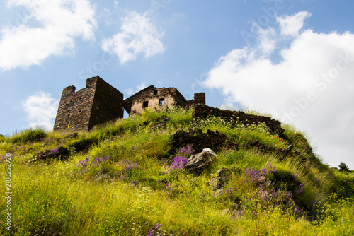 A striking view of the historic village of Chigo, perched dramatically on the steep mountain slopes of Tusheti