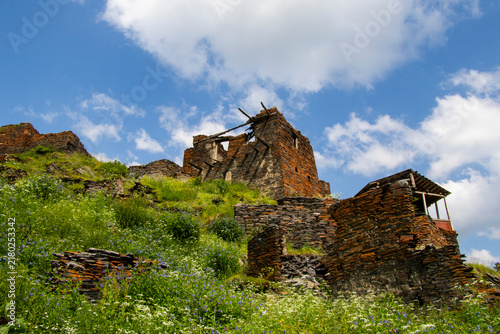 A striking view of the historic village of Chigo, perched dramatically on the steep mountain slopes of Tusheti
