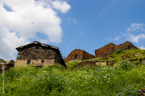 A striking view of the historic village of Chigo, perched dramatically on the steep mountain slopes of Tusheti