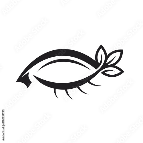 Black silhouette eye icon with green leaves design elements isolated on a clean white background for beauty and nature branding