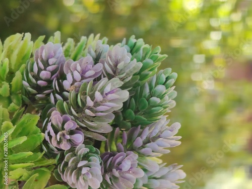 Fotografie Artificial flower decorations serve to beautify a room or event in a lasting way, without the hassle of watering or maintenance, and without the risk of wilting