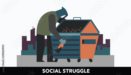 Homeless man in a hoodie searching for food or recyclable bottles in a public street dumpster at night.