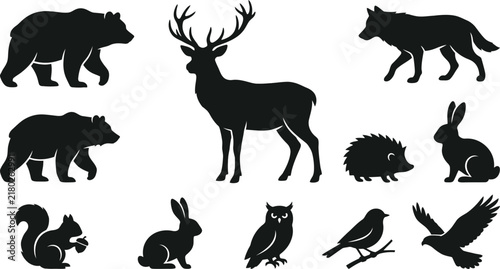 Set of black silhouettes of wild forest animals and birds isolated on a plain background