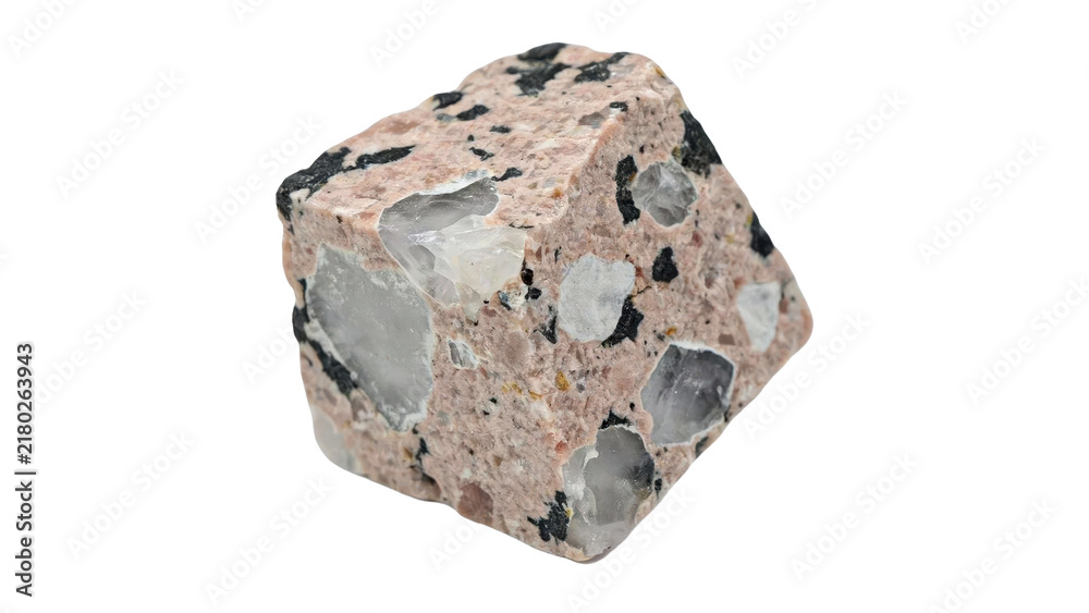 Obraz premium Rough cut piece of pink granite rock with embedded quartz crystals and black mineral inclusions isolated on a transparent background