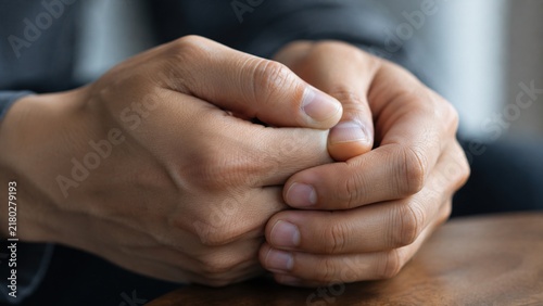 Clasped Hands Revealing Nervous Tension Through Subtle Cinematic Macro Detail