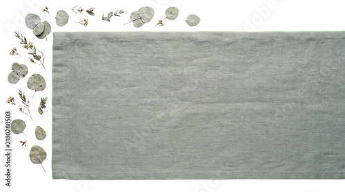Sage green linen table runner with dried eucalyptus leaves. Minimalist textile mockup for wedding decor and organic branding. isolated PNG with Transparent Background