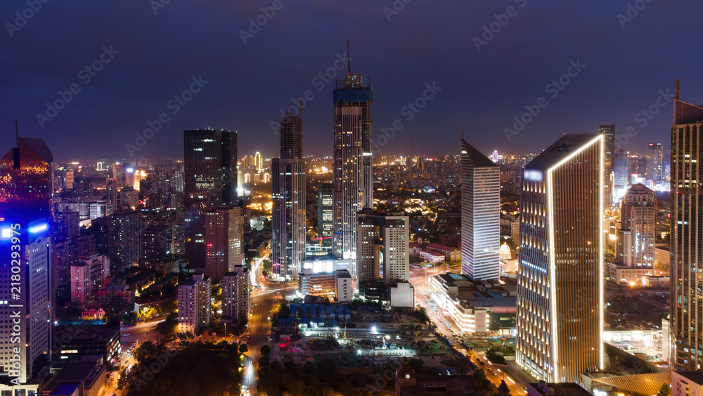 Fototapeta premium Night View of Modern Urban Skyscrapers and Cityscape