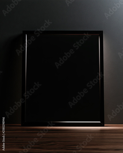 Glossy black square frame against dark wall on wooden floor