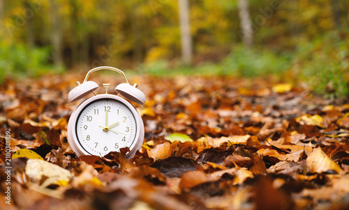 Принти на полотні End of daylight saving time in autumn, winter time changeover, alarm clock fall