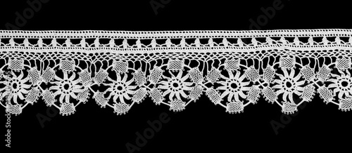 Bobbin lace tape isolated on black background, bobbin lace with gimp trim, vintage textile design, antique fabric art, doily
