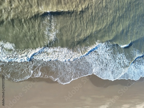 Картината върху платно Aerial View of Waves Breaking on a Sandy Beach Along the North Sea Coast in the
