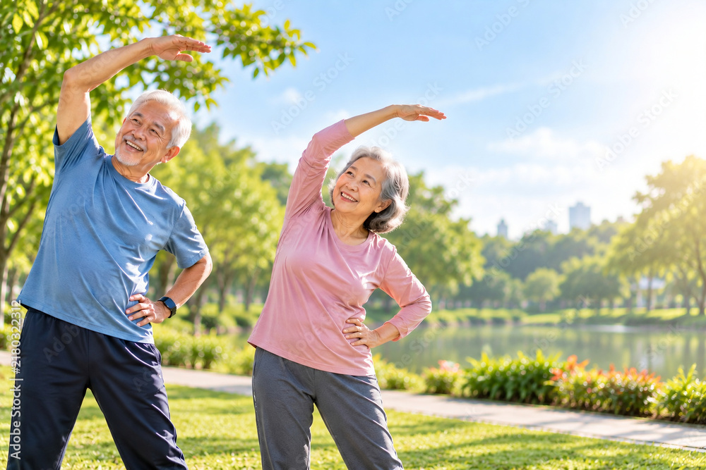 Obraz premium Active Senior Couple Exercising and Stretching Together in Sunny Park