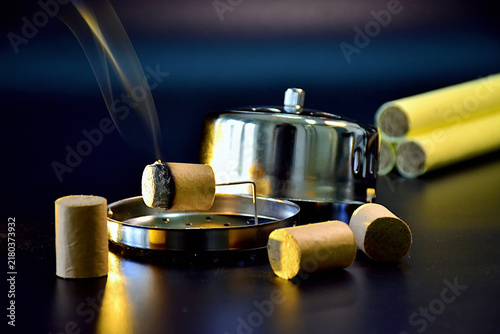 Foto Burning Moxa Sticks with Traditional Warmer